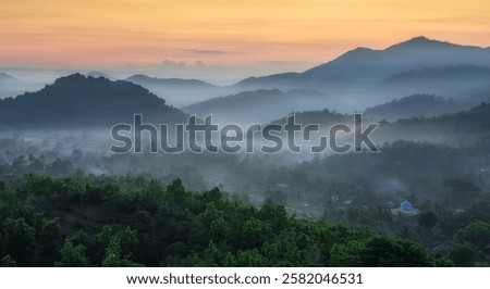 Misty mountain view at sunrise