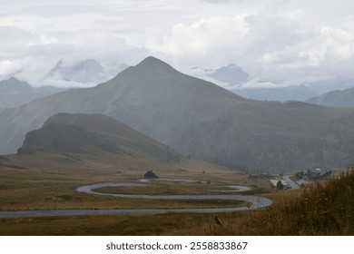 Misty mountain winding road leading from Passo di Giau - Powered by Shutterstock