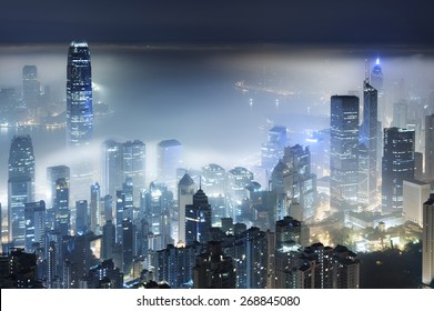 Misty night view of Victoria harbor in Hong Kong city - Powered by Shutterstock