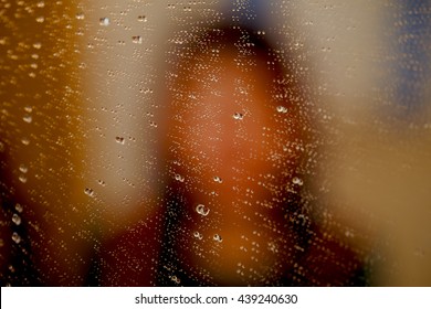 Misty Reflection Of Girl In The Mirror With Water Droplets