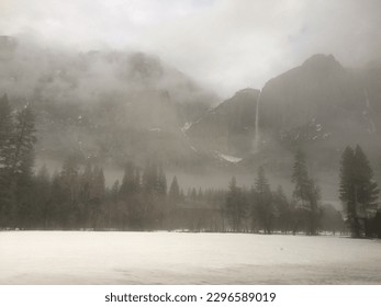 Misty Valley of Snowy Mountains with Waterfall - Powered by Shutterstock