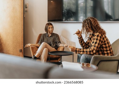 A misunderstanding between two young beautiful male and female colleagues. Male person explaining financial report to his female coworker, she does not understand him