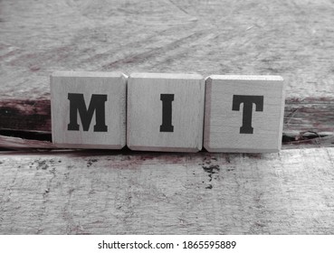 MIT Stands For Mujahid East Indonesia (Mujahid Indonesia Timur), Word Cube With Background.