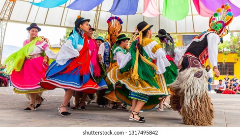 Mitad Del Mundo City, Pichincha, Ecuador, February 28, 2016. Women In Typical Costumes Of South American Indians Dancing With Colorful Traditional Costumes