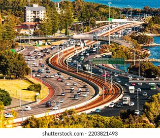 Mitchell freeway and Kwinana Freeway Western Australia. image taken from kings park looking South. direct view of Freeway heading north and south bound with a railway line in between.