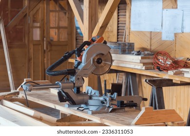 miter saw in the carpentry shop, the concept of ideas for the construction of woodworking and sawing machines. natural light. - Powered by Shutterstock