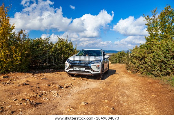 Mitsubishi\
Eclipse Cross, off-road crossover, test drive on the road with\
stones, -Russia, Crimea, October 18,\
2020.