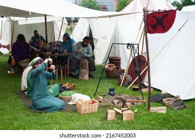 Mittelaltermarkt 2022, Medieval Market festival in Ulm, Germany - 27 May 2022. Artisans making fabric. Market offers medieval entertainment and workshops and classes.