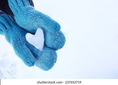 Mittens Holding A Snow Heart Shape