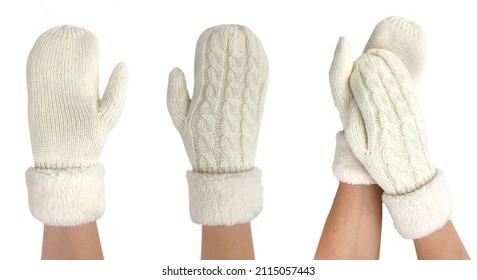 Mittens worn on a girl's hand. Isolated image on white background