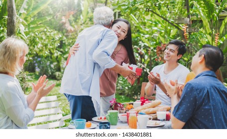 Mix Aged Big Family Enjoy Having Outdoor Birthday Party Eating Food At Backyard Home, Warm And Happy Lifestyle Family Concept