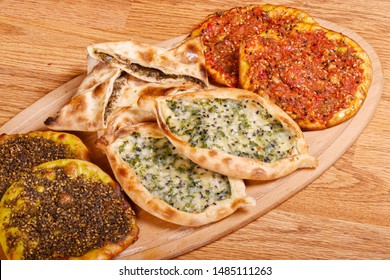 Mix Baked Fatayer and Manakeesh Pastry Styled and Garnished on a Plate - Shutterstock ID 1485111263