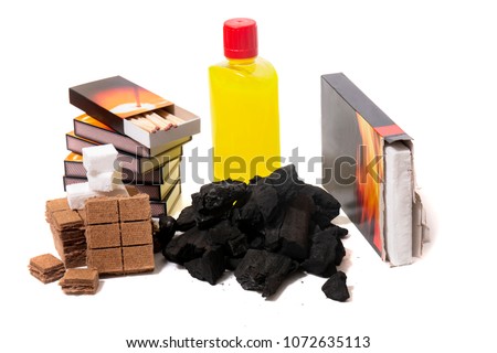 Mix of barbecue firestarter elements, including charcoal, matches, flame liquid and others.