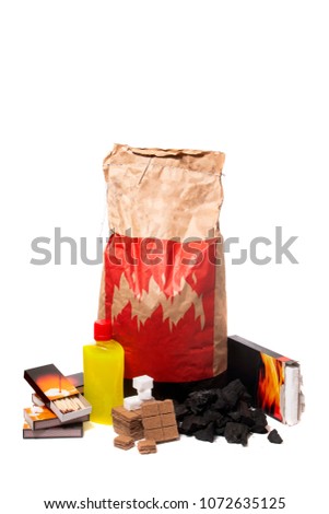 Mix of barbecue firestarter elements, including charcoal, matches, flame liquid and others.