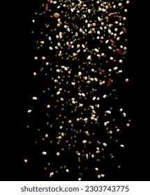 Mix beans fall down explosion, several multi kind bean float explode. Dried mixed white green red soy black peanut beans splash throwing in Air. Black background Isolated