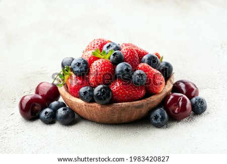 Similar – Bowl with red berries and mint leaves