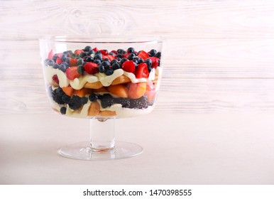 Mix berry and fruit trifle served in a bowl