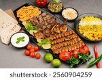 Mix chicken grill kabab, tikka, boti, salad and bread served in a dish, Arabic Platter, Mix Grill Platter with chicken tikka, beef kabab, mutton kebab, seekh kabab and lamb chop with salad and fries