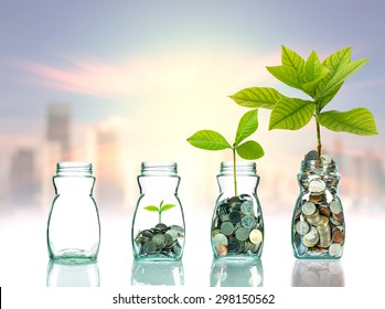 Mix coins and seed in clear bottle on cityscape photo blurred cityscape background,Business investment growth concept