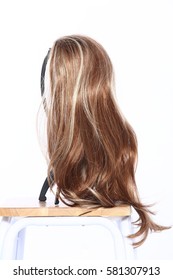 Mix Color Blonde Dark Brown Hair Wig On Head Holder Stand On Wood Table Floor White Background Studio Lighting