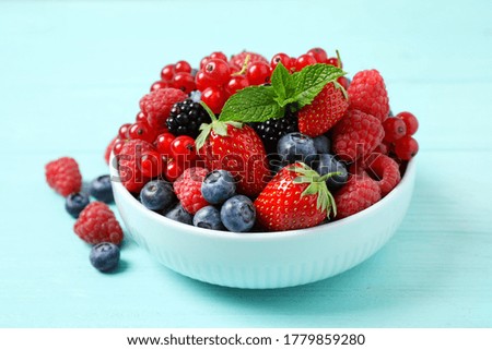 Similar – Bowl with red berries and mint leaves