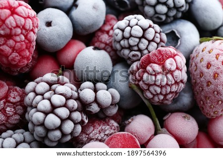 Mix of different frozen berries as background, closeup