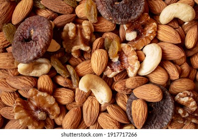 Mix Of Dry Fruits Containing Almonds, Walnuts, Raisins And Dried Figs. Healthy Food Concept