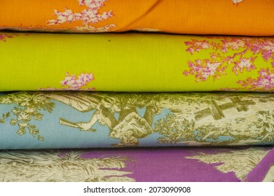 Mix Fabrics. Shop Counter. Many Fabrics Of Different Types. View From Above. Printed, Cotton, Mixed Jersey. For Sewing Clothes And Bed Linen.