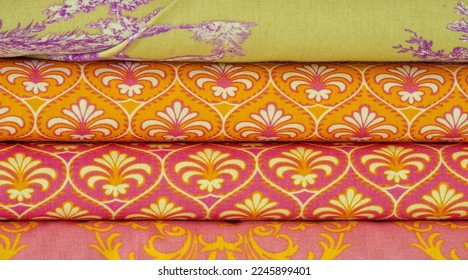 Mix fabrics. Shop counter. Many fabrics of different types. View from above. Printed, cotton, mixed jersey. For sewing clothes and bed linen. - Shutterstock ID 2245899401