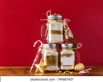 Mix Of Flour, Sugar, Nuts For Baking In A Jar . Christmas Mood Theme. Handmade Gift.