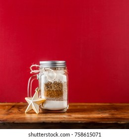 Mix Of Flour, Sugar, Nuts For Baking In A Jar . Christmas Mood Theme. Handmade Gift.