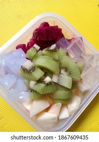 Mix Fruit In A Tupperware.