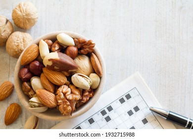 Mix Of Nuts In Bowl And Crossword, Healthy Snack For Good Memory