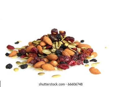 Mix Nuts, Dry Fruits And Chocolate On A White Background