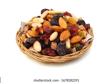 Mix Nuts, Dry Fruits And Grapes In Basket On A White Background 