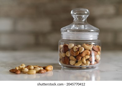 Mix Of Nuts In A Transparent Jar, Cashews, Almonds, Hazelnuts