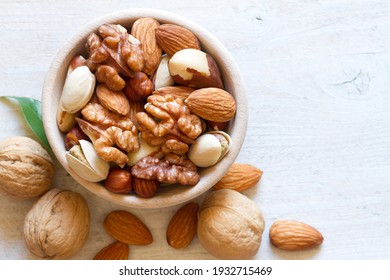 Mix Of Nuts In Wooden Bowl. Healthy And Tasty Snack