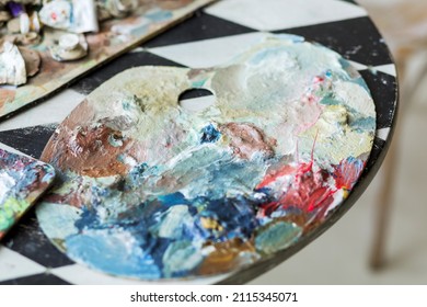 Mix Of Oil Paints On A Wooden Palette. Fine Art Set