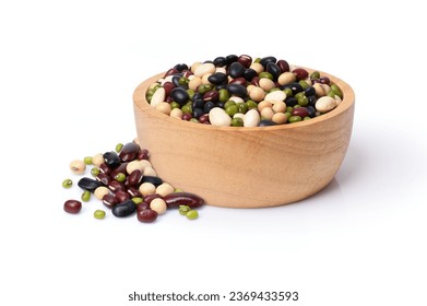 Mix organic beans with soybean, red beans, green mung bean and black gram) in wooden bowl isolated on white background. 