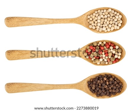 mix of peppercorn in wooden spoon isolated on white background. Top view. Flat lay