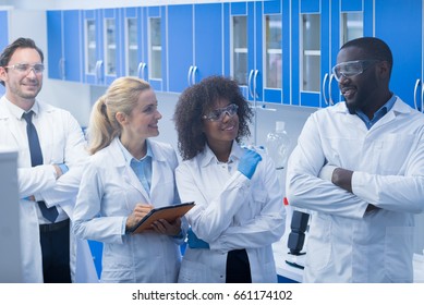 Mix Race Scientists Team Working In Laboratory Doing Research, Man And Woman Making Scientific Experiments Doctors In Lab