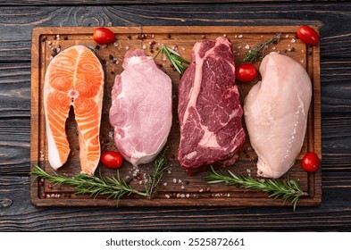 Mix of raw meat and fish . Salmon , beef , pork , chicken staek . Top view photography