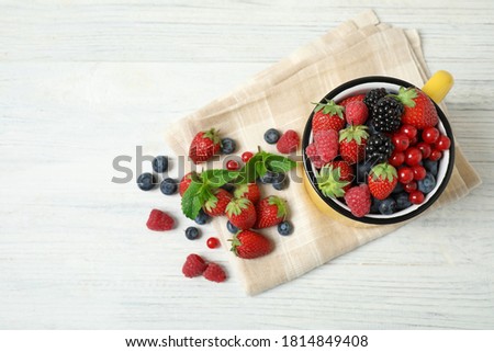 Similar – Image, Stock Photo Bowl of strawberries, blueberries and mint leaves