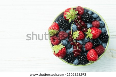 Image, Stock Photo Bowl of strawberries, blueberries and mint leaves