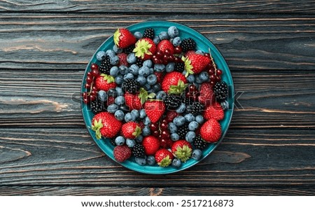 Similar – Image, Stock Photo Bowl of strawberries, blueberries and mint leaves