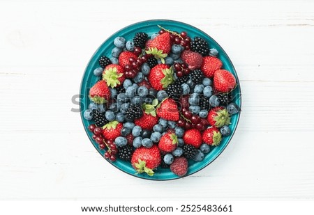 Similar – Image, Stock Photo Bowl of strawberries, blueberries and mint leaves