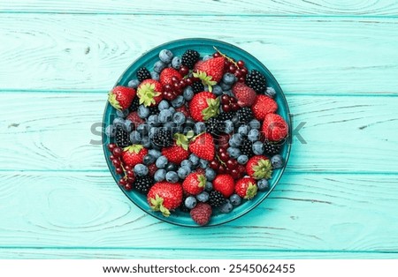 Similar – Image, Stock Photo Bowl of strawberries, blueberries and mint leaves