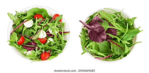 Mix salad - arugula, spinach, chard, cherry tomatoes and mozzarella in the bowl isolated on white background. Top view. Flat lay