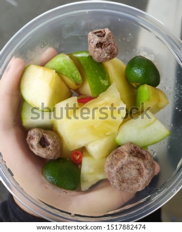 Mix of topical fruits and asamboi with some small cuts of red chilli. The mixture of all the ingredients complimet each other with the taste of sweet fruits, sour asam and also little hint of spicy Stock photo © 
