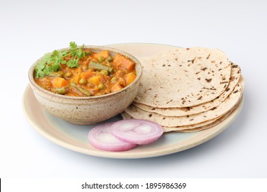 Mix Veg Curry Made From Beans, Carrot, Potato Coriander Topping With Chapati And Onions, Indian Food Plate Or Thali